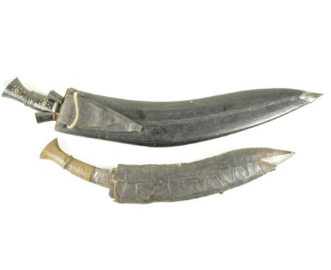 Kukris - 1) Large Tourist Kukri. Heavy blade 20" marked 'India'. with smaller knives in its leather scabbard. 2) A working Ku