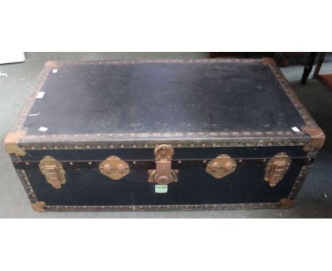 A blue, metal bound trunk