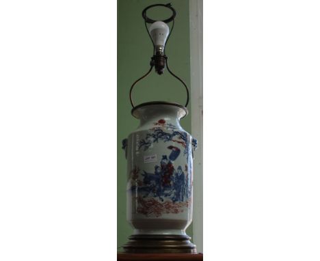 An Oriental ceramic vase, converted to a table lamp, with figure decoration complete with shade, a/f  Condition: The vase has