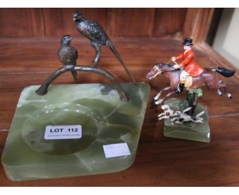 A green onyx ashtray mounted with a brace of painted metal pheasants, together with a model of a painted metal huntsman &amp;
