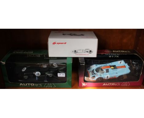 Two Auto Art model cars, being a Jaguar C-type & a Porche 917k, together with a Lotus racing car, all boxed Condition: Both m