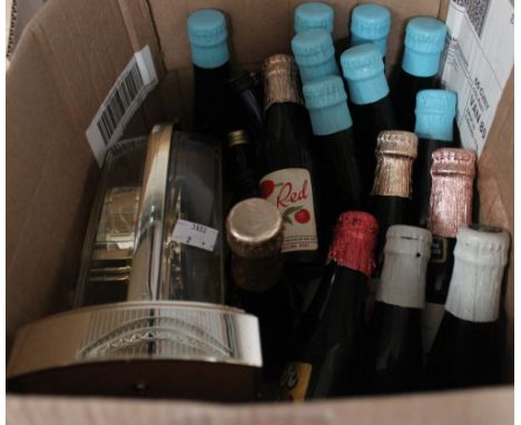 A small box containing a collection of Babycham, Cherry B &amp; other exotic drinks, together with a clock