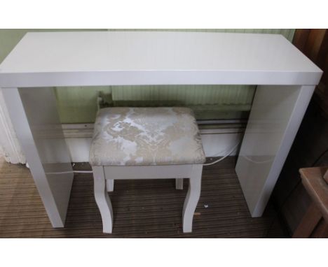 A white melamine dressing table together with stool