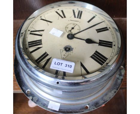 A chromed bulkhead ships clock with roman numerals, marked J F &amp; S