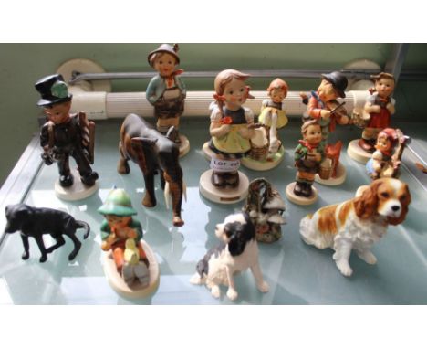A collection of Hummel children figurines, together with others
