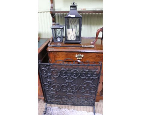A wrought metal spark guard, a poker, two lanterns &amp; a folding card table