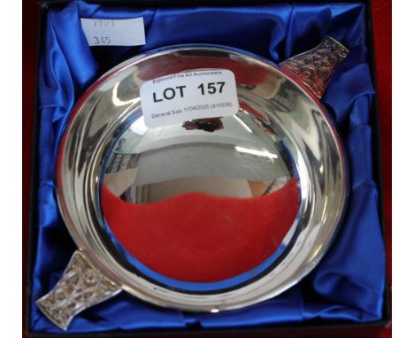 A white metal quaich, with Celtic decoration, in presentation box