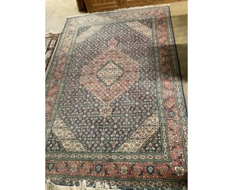 An Iranian blue ground carpet, 300 x 200cm. Condition - fair