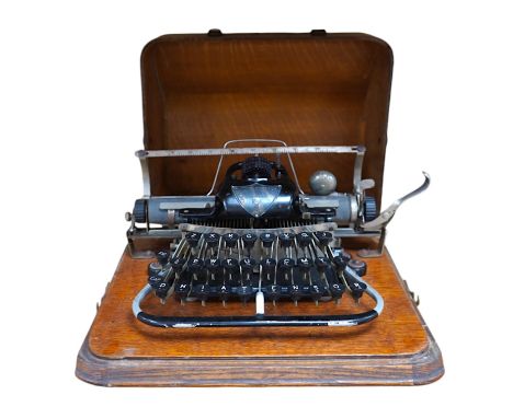 A late 19th century Blickensderfer Newcastle-on-Tyne, manual typewriter, model No.7, in an oak case with oak plywood cover, M