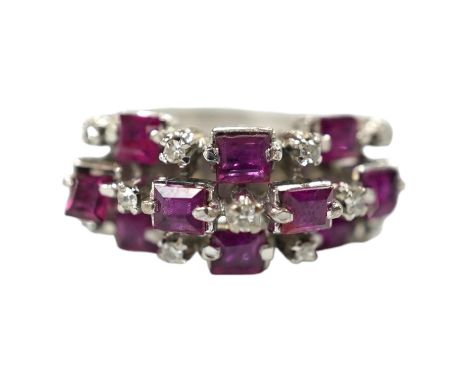 An 18k white metal, ruby and diamond cluster set cocktail ring, size K/L, gross weight 5.7 grams. Condition - fair to good