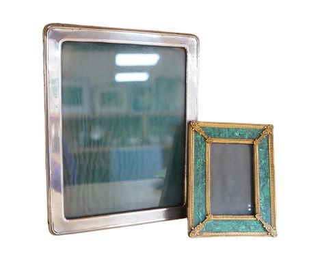 An early 20th century silver mounted photograph frame and a faux malachite gilt easel frame, largest 24cm high. Condition - f