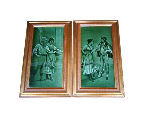 A pair of Craven Dunhill green glazed figurative framed tiles, 29.5cm high, 14cm wide. Condition - good