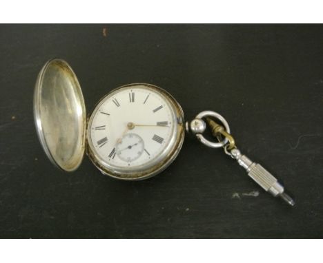POCKET WATCH - A silver cased pocket watch with enamel dial, Roman numeral markers & subsidiary seconds dial. Case fully Hall