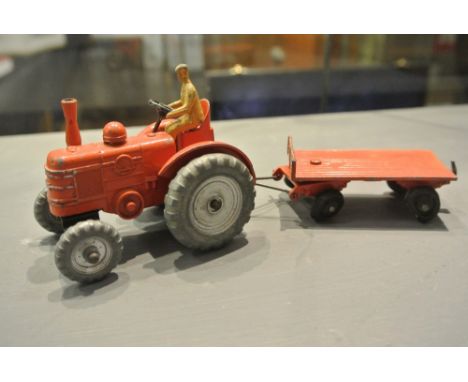 COLLECTABLES - An original Dinky No.301/27n Field Marshall Tractor in burnt orange with silver trim, bare metal/silver wheels