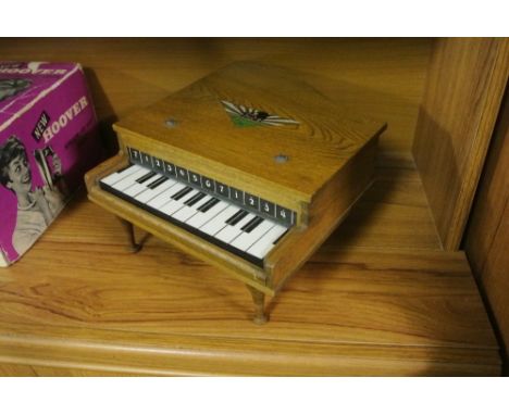 COLLECTABLES - A vintage miniature grand piano with playable keys.