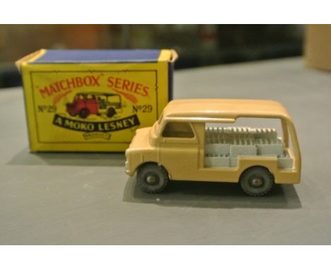 COLLECTABLES - An original Matchbox Regular Wheels No.29 Bedford Milk Float with light tan body, white base and crates, metal