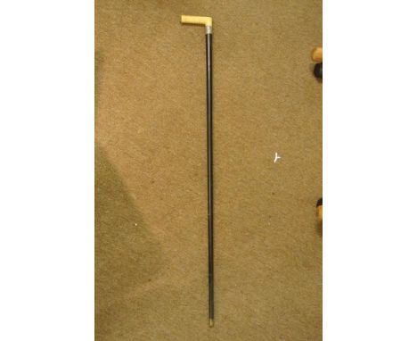 COLLECTABLE - An antique cane with ebony shaft & bone handle, measuring 91cm tall, with silver collar.