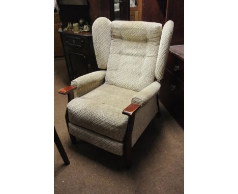 FURNITURE/ HOME - A vintage Parker Knoll style wing back fireside recliner chain.