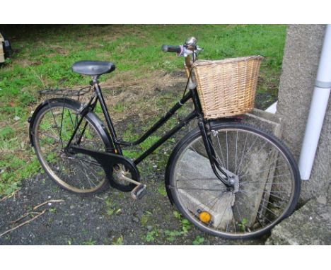 AUTOMOBILIA/ BICYCLE - A vintage ladies bicycle with painted black frame, basket & bell, in working condition. 