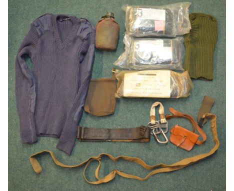 Box containing a number of pieces of military uniform, RAF jersey, vintage WWII style slip, belt, leather cartridge pouch, et