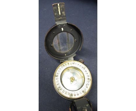 T. G. &amp; Co marching compass with registration no. 218230, with crowsfoot military arrow dated 1943, MKIII 