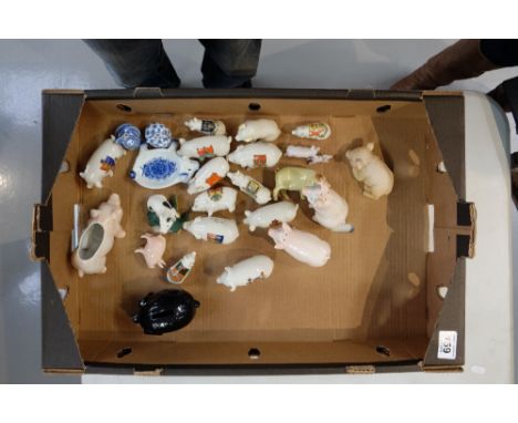 A collection of ceramic pig ornaments to include many Shield back items  