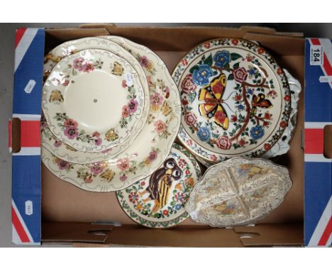 A good collection of continental and English decorative plates, chargers and cake stands (some boxed) including Delft, Zsonay