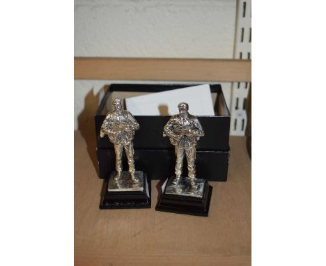 Two Royal Hampshire silver plated models of soldiers together with a further similar model owl