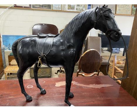 Leather mounted model of a horse