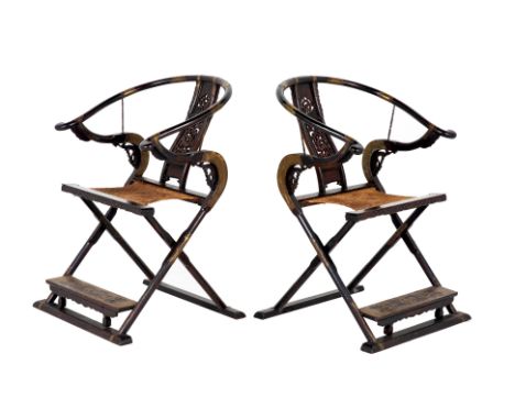 A PAIR OF CHINESE FOLDING HUNTING CHAIRS
With carved and pierced splat, a woven seat and brass mounts,
101 x 70 x 84cm
Condit