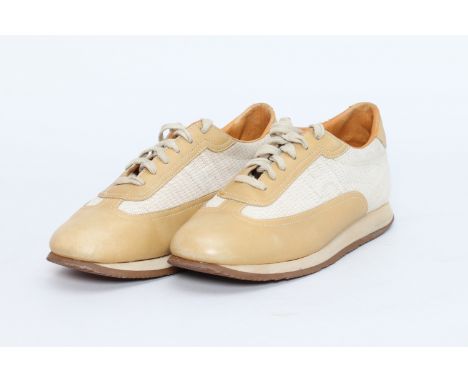 A PAIR OF HERMES SNEAKERS EU 41
Mustard leather and white canvas lace up sneakers
EU 41
Condition: VINTAGE - Condition is com
