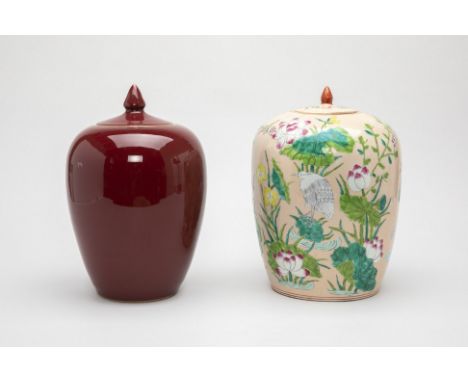 TWO OVOID PORCELAIN JARS AND COVERS
One decorated with a light pink ground with lotus and birds over green foliage, the other