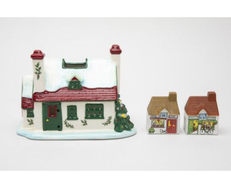 A SPODE CHRISTMAS COTTAGE TEA LIGHT HOLDER
With lift off roof; together with two small Wade cottages (3)
20cm long x 12.5cm w