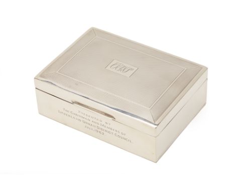 A SILVER TABLE BOX
Harman Bros, Birmingham 1961
The engine turned cover engraved within initials and inscription to front dat