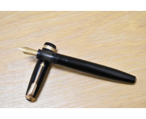A Parker Duofold button fill fountain pen in black with decorative band to the cap having Parker Duofold 14k N nib. Boxed
