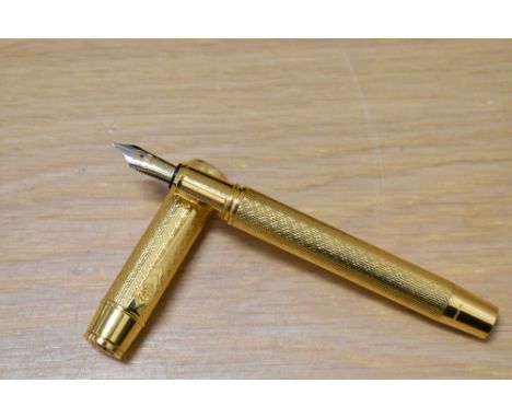 An Onoto University of Cambridge limited edition fountain pen 5/100 in vermail 23ct gold plate on sterling silver, with the b