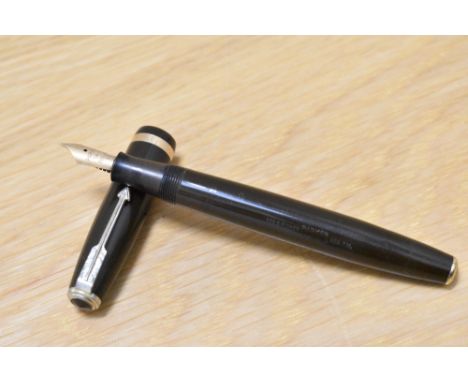 A Parker Duofold button fill fountain pen in chocolate brown with decorative band to the cap having Parker Duofold 14k Englan