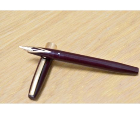 A Sheaffer Imperial IV Touchdown in burgundy with broad band to the base of the cap having a Sheaffer 14k R USA nib.