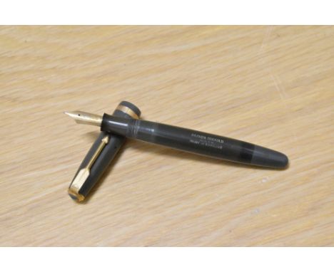 A Parker Duofold button fill fountain pen in grey with decorative band to the cap having Parker Duofold 14k N nib. Engraved a