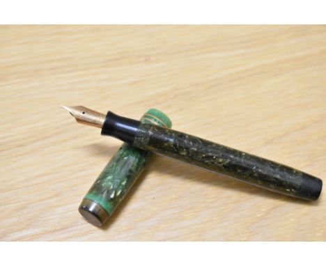 A Parker Duofold Senior Slimline button fill fountain pen in jade green with two narrow bands to the cap having Parker Duofol