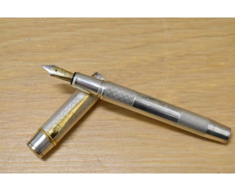 An Onoto University of Cambridge limited edition fountain pen 1/200 in solid sterling silver, with the barrel featuring an en