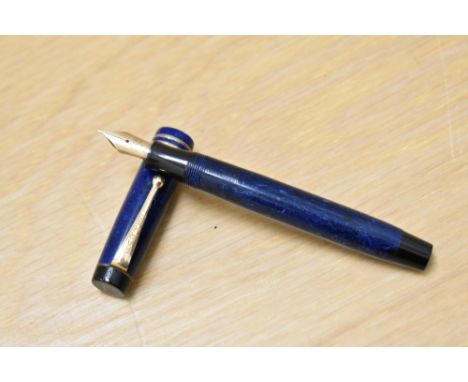 A Parker Streamlined Duofold button fill fountain pen in Lapis blue with two bands to the cap having a Parker Duofold 14k Can