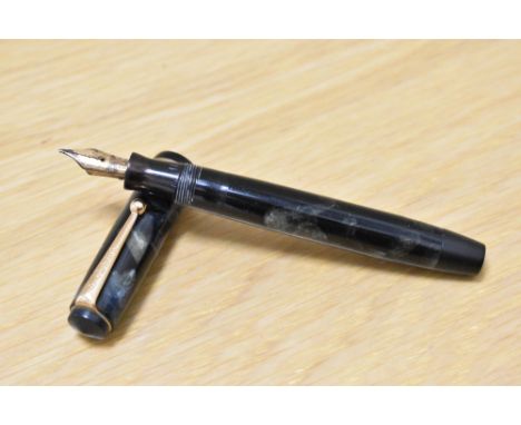 A Parker Premiere button fill fountain pen in black and grey marble with single narrow band to the cap having Parker 14k nib