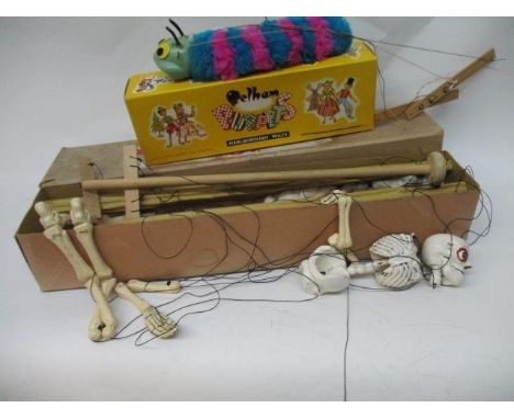 An early skeleton Pelham puppet with original box, together with a 1960s caterpillar Pelham puppet with original box 