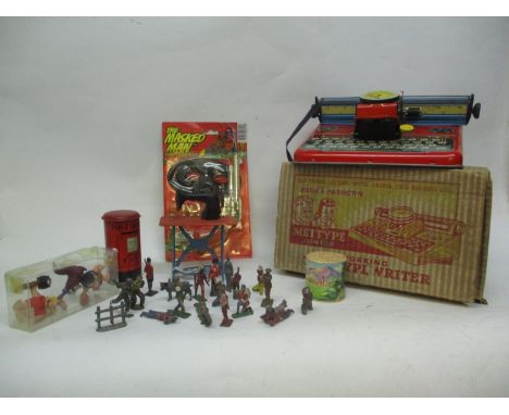 A mixed lot of vintage toys to include lead toy figures, Flintstone figures, a Post Office moneybox, a masked man gun set, a 