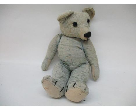 A 1920s English full jointed teddy bear with glass eyes worn, blue artificial silk plush and squeaker, 18" high, possibly Cha