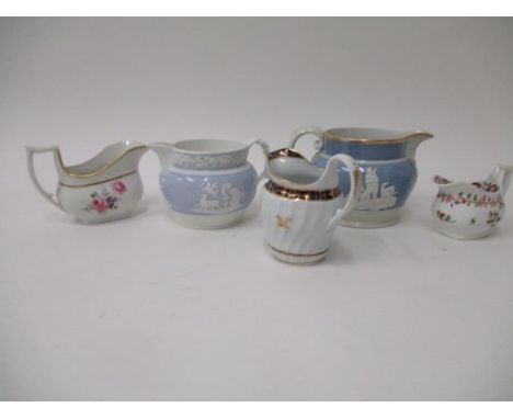 Five 18th and 19th century English jugs, two decorated in relief, one with hunting scenes and dated 1822, on a blue ground, 4