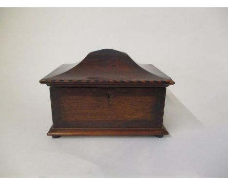 A 19th century boxwood and ebony inlaid rosewood and oak tea caddy, with a hinged pagoda lid, enclosing twin lidded compartme