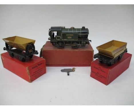 A Hornby No 40 clockwork tank locomotive, an 0 gauge Hornby No 1, an 0 gauge side tipping wagon McAlpine, a Hornby No 1 0 gau