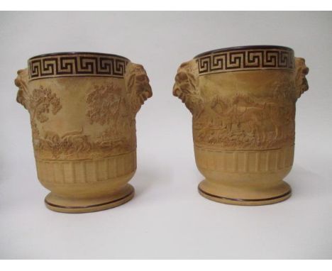 A pair of early 19th century Davenport caneware wine coolers, moulded in relief with a hunting scene of horses, hounds and tw